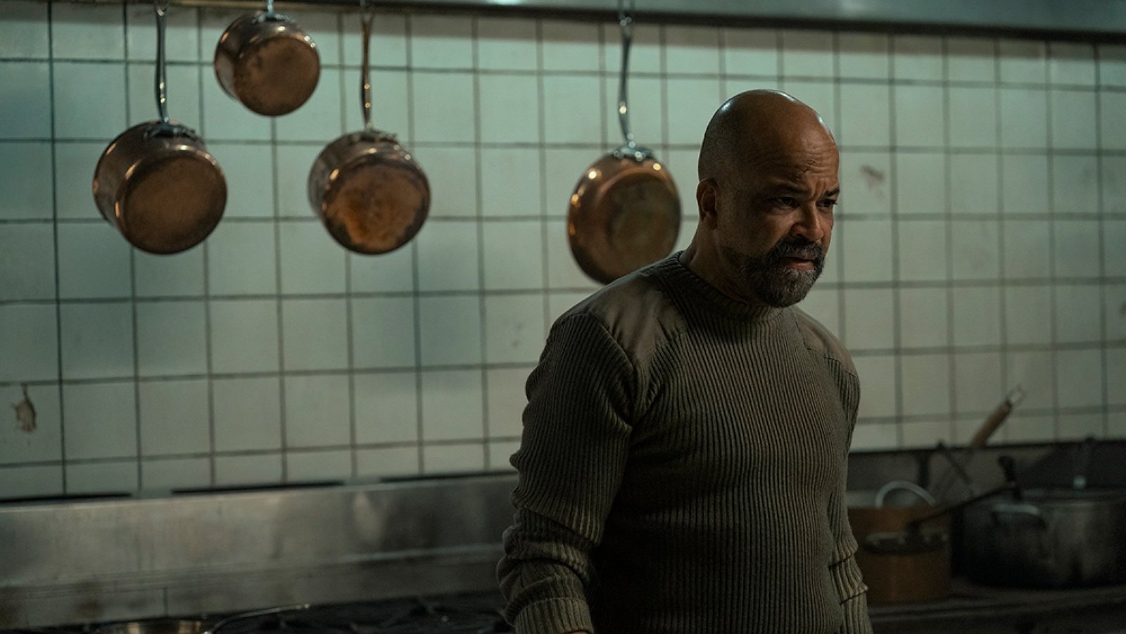 A man stands in a kitchen.