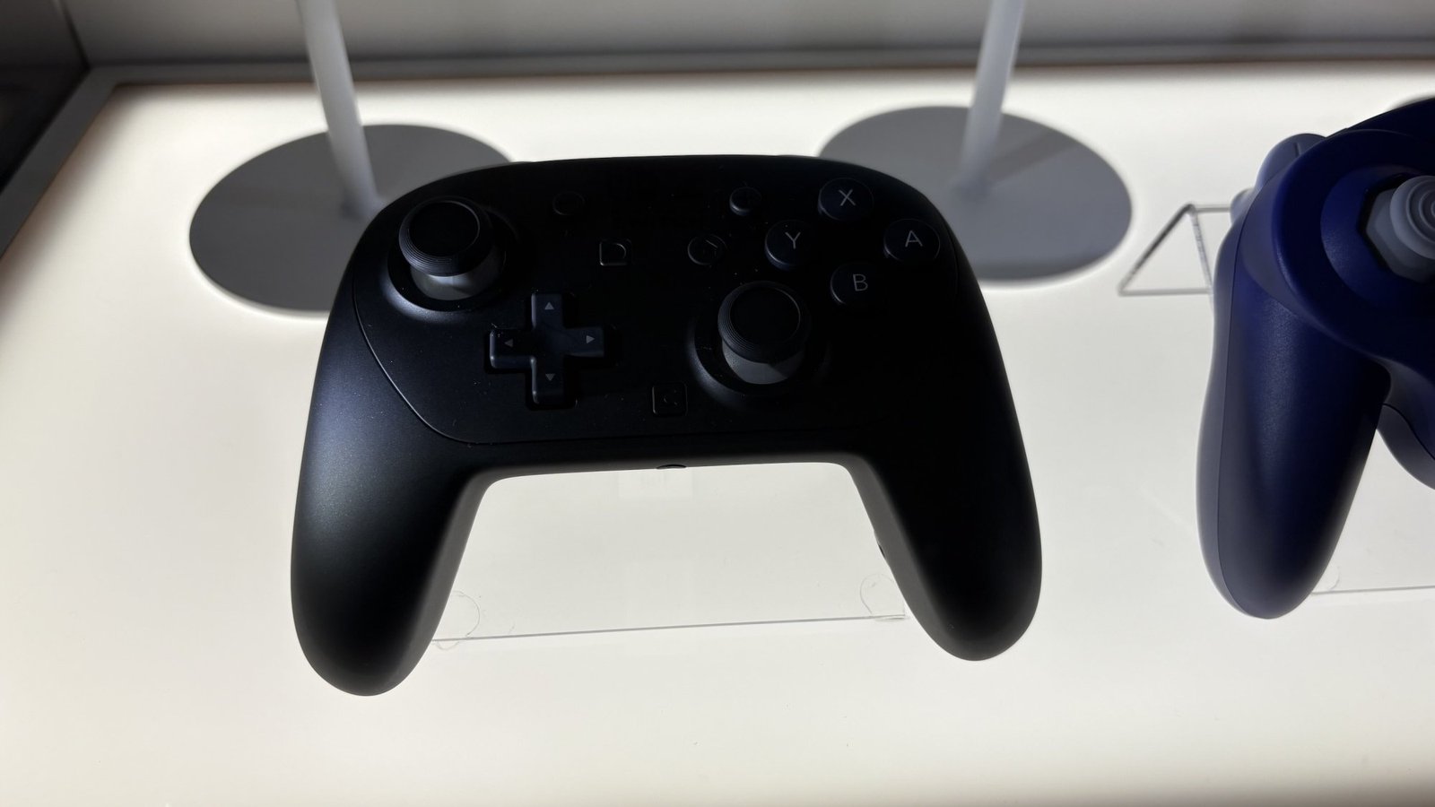 Nintendo Switch 2 Pro Controller behind glass case